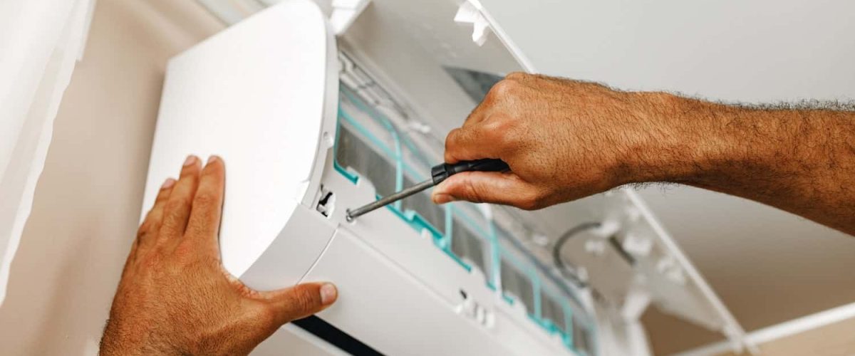 close-up-of-repairman-fixing-air-conditioner-in-a-2021-09-03-17-24-01-utc-min-min.jpg